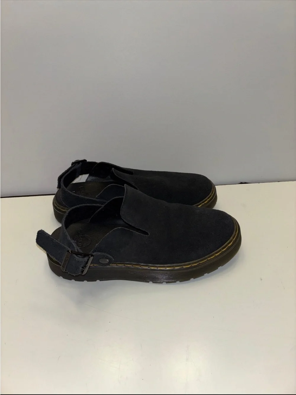 Dr. Martens Carlson slingback mules in black suede, with a chunky buckle